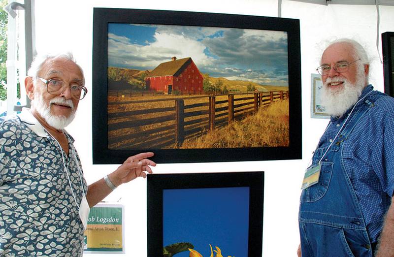 Bob Logsdon, Grand Detour, right poses with his photo titles “Red Barn” which won Best of Show at the Fields Project’s Fine Arts and Crafts Festival at Mix Park on Sunday. At left, is Joe Popp, Oregon, president of the Fields Project. Photo by Earleen Hinton