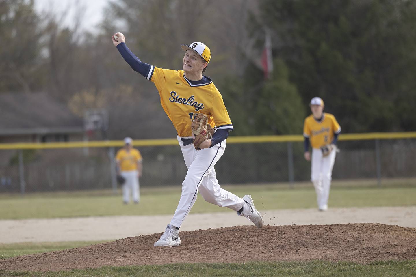 Sterling’s Garrett Polson fires a pitch against Newman Tuesday, March 12, 2024.