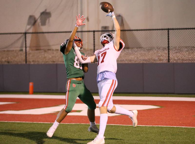 Ottawa's Owen Sanders misses a catch as  L-P's Jonah Sherman defends on Friday, Sept. 13, 2024 at Howard Fellows Stadium.