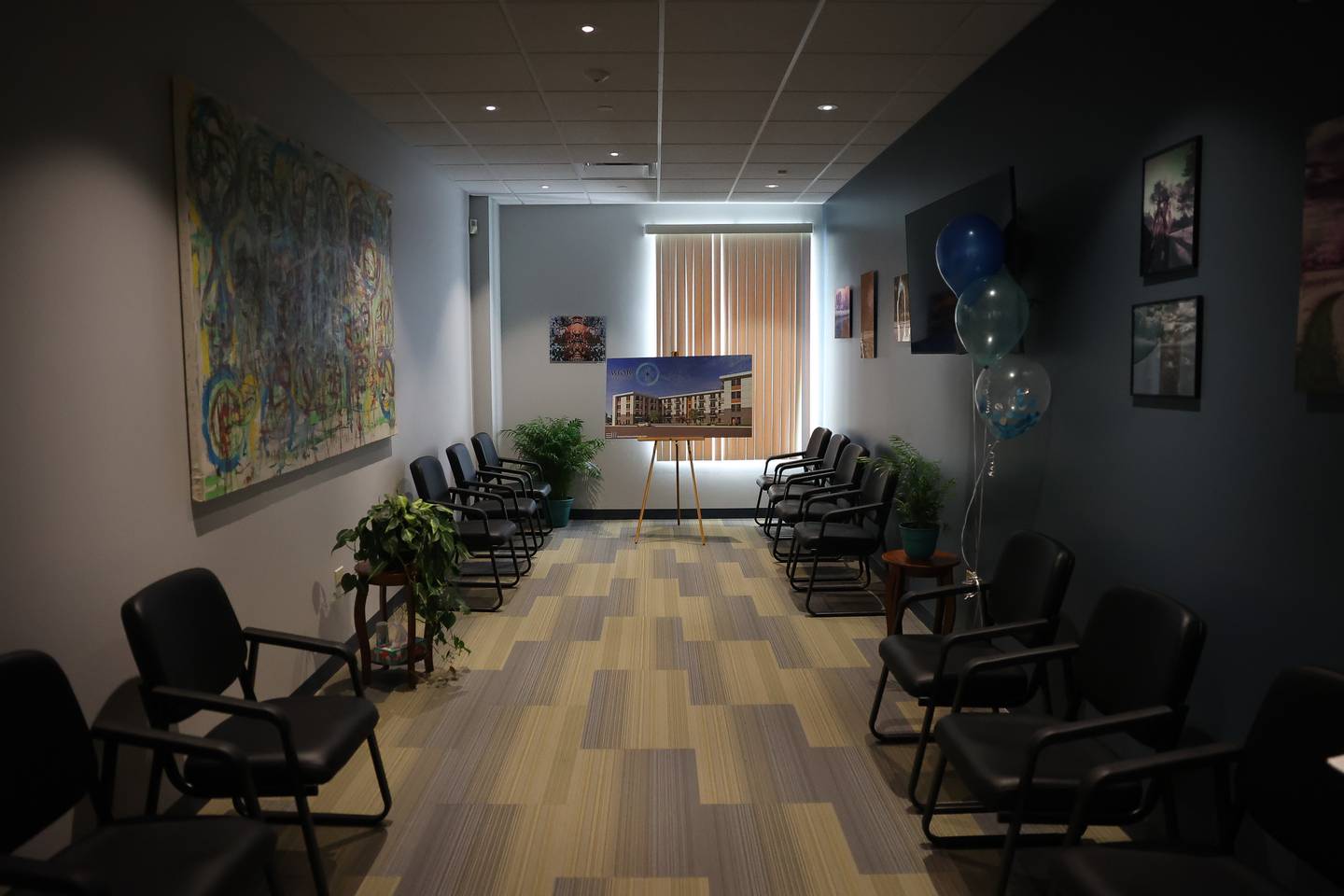 The newly renoved lobby at the Will-Grundy Medical Clinic features art loaned by The Strange & Unusual Gallery during an open house on Saturday, April 20, 2024 in Joliet.