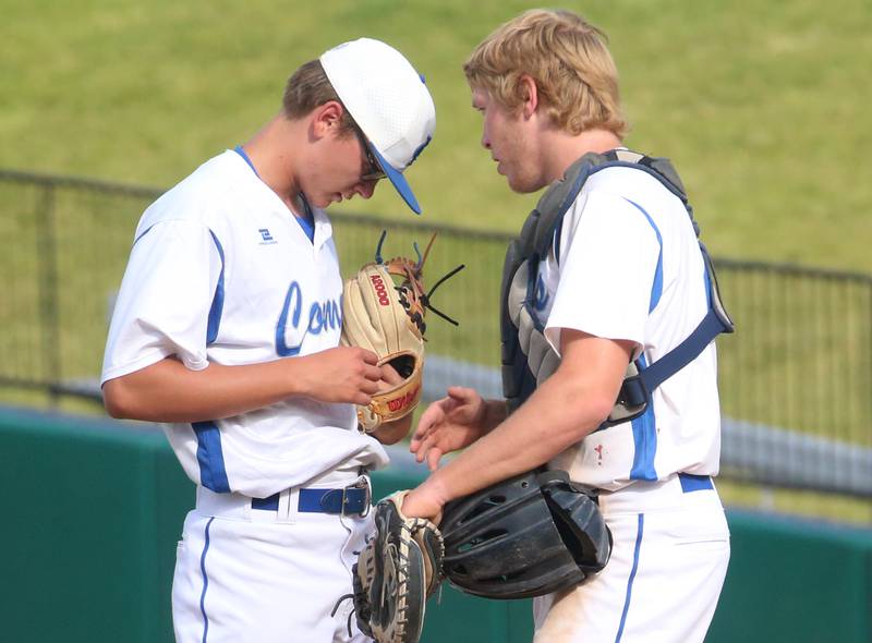 Newman's Chase Decker and Daniel Kelly meet on the mound during the Class 2A semifinal game on Friday, May 31, 2024 at Dozer Park in Peoria.