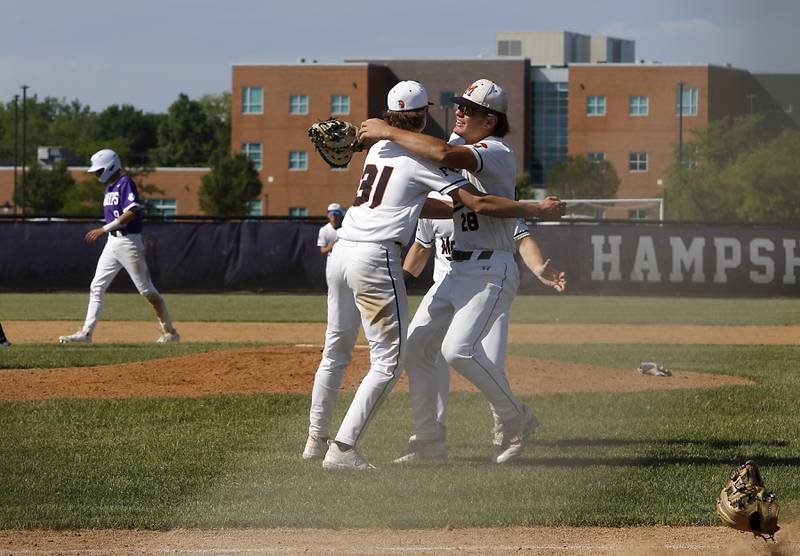 McHenry's Kaden Wasniewski celebrates with teammate, Donovan Christman, after McHenry defeated Hampshire 5-4 in a Class 4A Hampshire sectional baseball game on Wednesday, May 29, 2024, at the Hampshire High School.