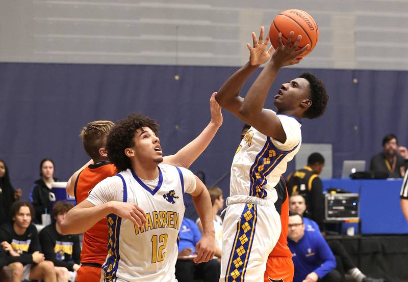 Warren's Jaxson Davis gets a shot in the lane Tuesday, Feb. 27, 2024, during their Class 4A sectional semifinal game against DeKalb at Rock Valley College in Rockford.