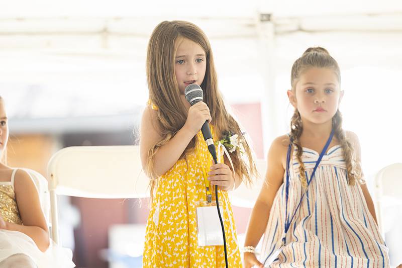 Chloe Bartelt, 6, sings for her shot at the Little Miss title Thursday, June 13, 2024, at Polo’s Town and Country Days.