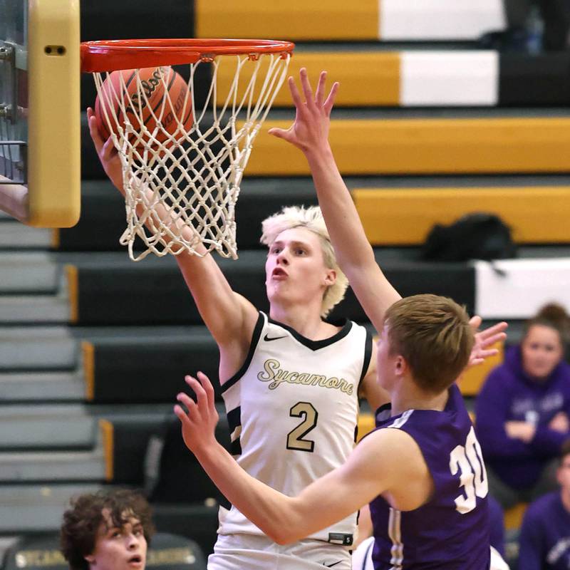 Sycamore's Aidan Wyzard gets to the basket in front of Rochelle's Eli Luxton during their game Tuesday, Dec. 5, 2023, at Sycamore High School.