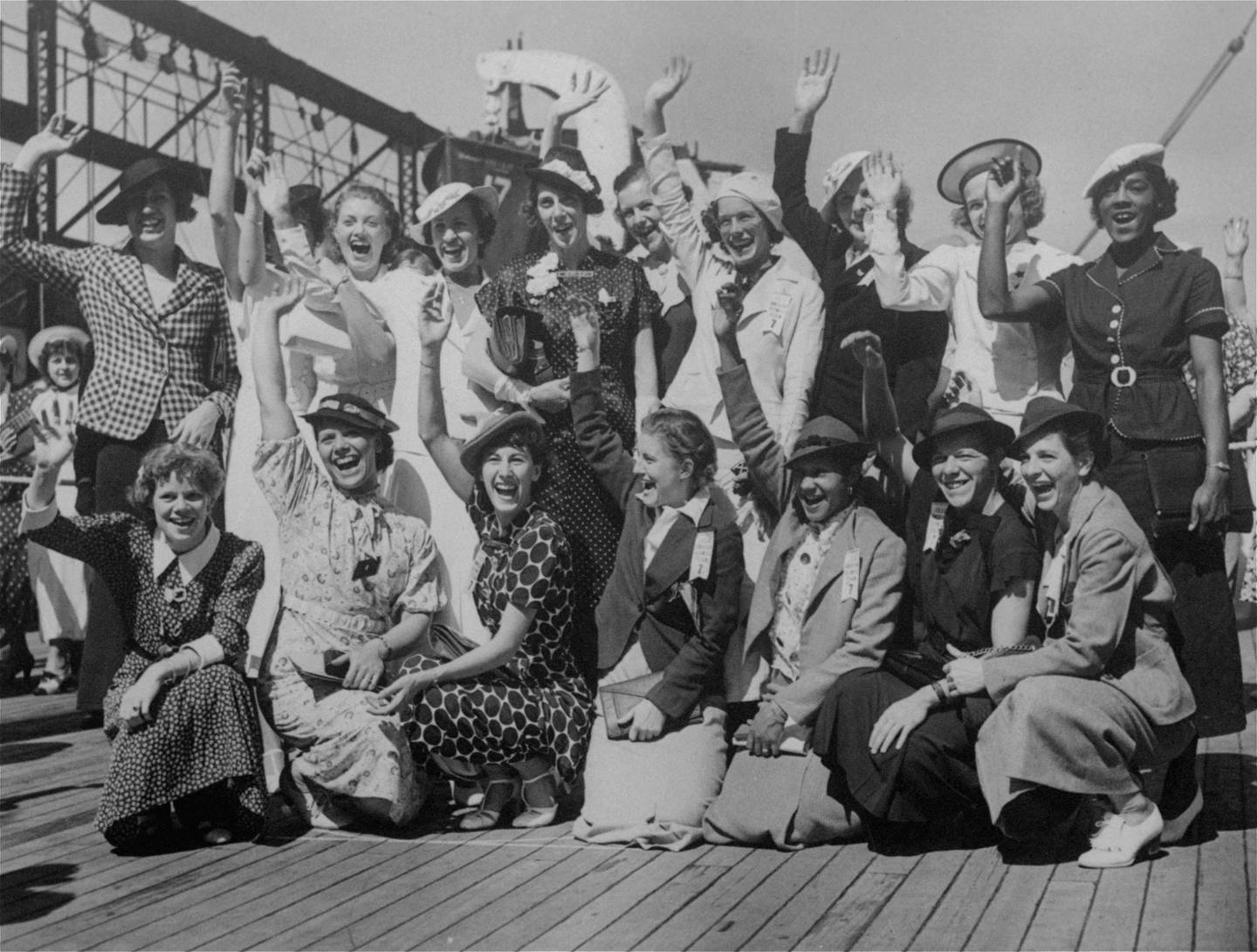 Women's Olympic track and field squad as they left for Europe on the SS Manhattan, July 15, 1936. Front row, (from left): Harriett Bland, St. Louis; Evelyn Ferrara, Chicago; Simone Schaller, California; Olive Hasenfus, Boston; Tidye Pickett, Chicago; Betty Burch, Boston; Josephine Warren, Boston. Back row: Helen Stephens, Fulton, Mo.; Martha Worst, California; Alice Arden, New York; Annette Rogers, Chicago; D. Boeckmann, coach and manager; Katherine Kelly; Anne O'Brien, California; Gertrude Wilhelmson; Betty Robinson, Chicago; Louise Stokes.