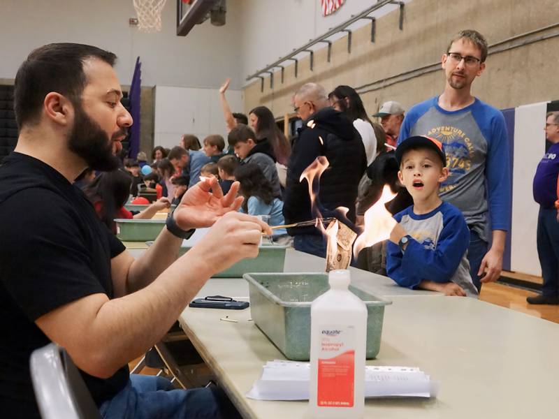 Mohamed Aburomi demonstrates fire resistance with money and rubbing alcohol on Friday, April 19,
2024, at Illinois Valley Community College's SciFest in Oglesby.
