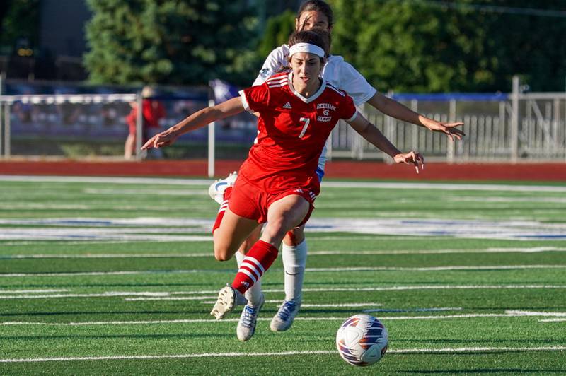 Naperville Central's Isabella Brozek (7) plays the ball on a fast break against St. Charles North during a Class 3A St. Charles North Supersectional soccer final match at St. Charles North High School on Tuesday, May 28, 2024.