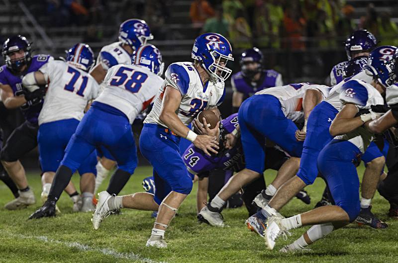 Genoa-Kingston’s Brady Brewick picks up yards Thursday, Sept. 14, 2023 in a game at Dixon High School.