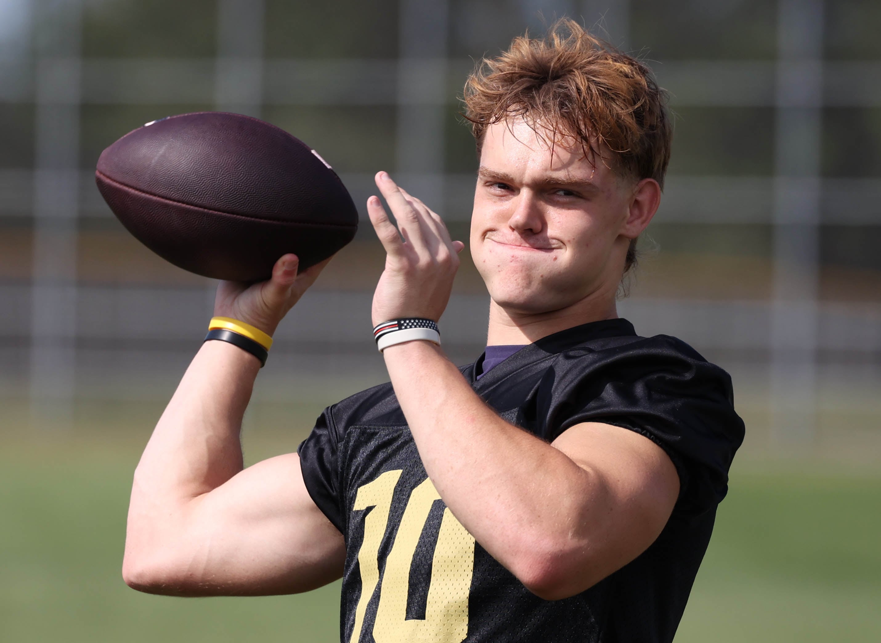 Sycamore quarterback Burke Gautcher warms up Monday, Aug. 12, 2024, for the first practice of the regular season.