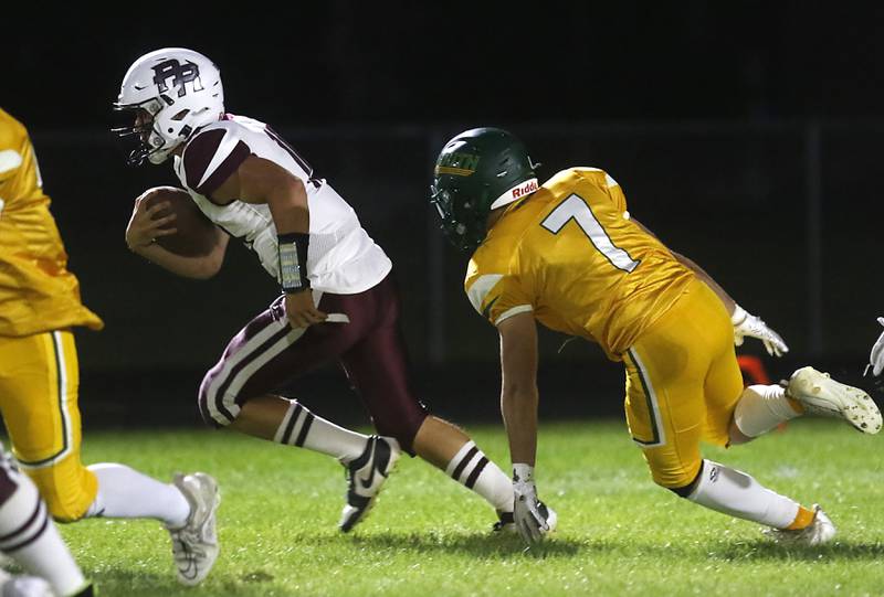 Crystal Lake South's Giovan Evers runs away from the pursuit of Crystal Lake South's Brock Miller during a Fox Valley Conference football game on Friday, Sept. 6, 2024, at Crystal Lake South High School.