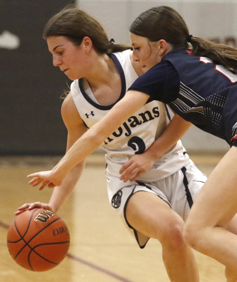 St. Viator's Ellen Denten fouls Cary-Grove's Kennedy Manning during an IHSA Class 3A Antioch Sectional semifinal girls basketball game on Tuesday, Feb. 20, 2024, at Antioch High School.