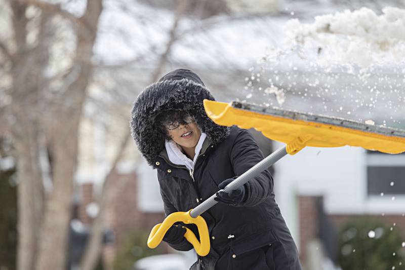 Alyssa Ashley clears snow Wednesday, Jan. 10, 2024 in Dixon. The Sauk Valley is gearing up for another round as snow is expected to hit the area on Friday.