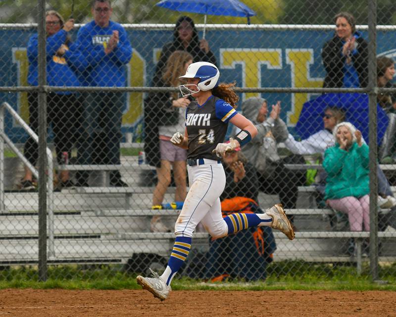 Wheaton North's Monica Kading (24) jogs to home plate after hitting a home run during the game on Monday May 13, 2024, while taking on Glenbard North.