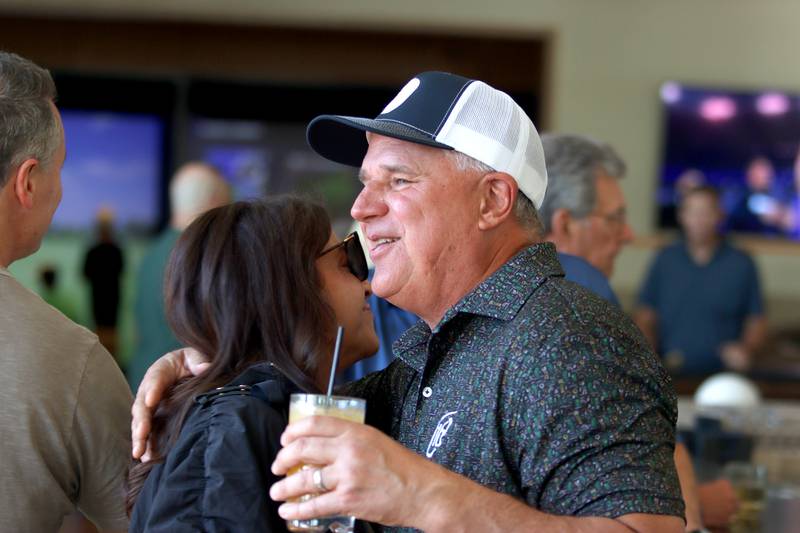 Darryl Postelnick greets others during a patio launch party at Pickle Haus in Algonquin Friday night. Postelnick, known in social media circles of “Cooking With Darryl” fame, collaborated with Pickle Haus to create “Chicago-style cheesy beef pizza”