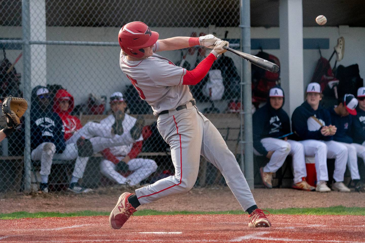 Yorkville's Nate Harris (15) homers against West Aurora during a baseball game at West Aurora High School on Monday, April 24, 2023.