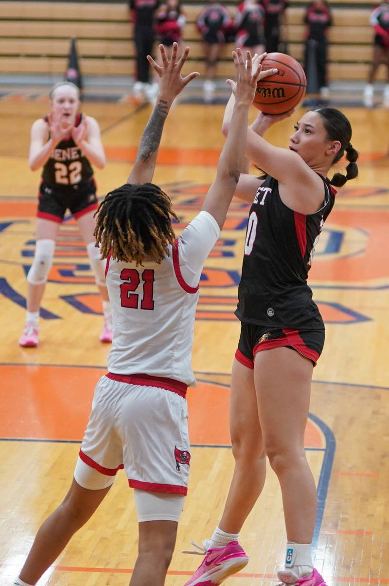 Benet’s Emma Briggs (20) shoots the ball in the post aghast Bolingbrook's Persais Williams (21) during a Oswego semifinal sectional 4A basketball game at Oswego High School on Tuesday, Feb 20, 2024.