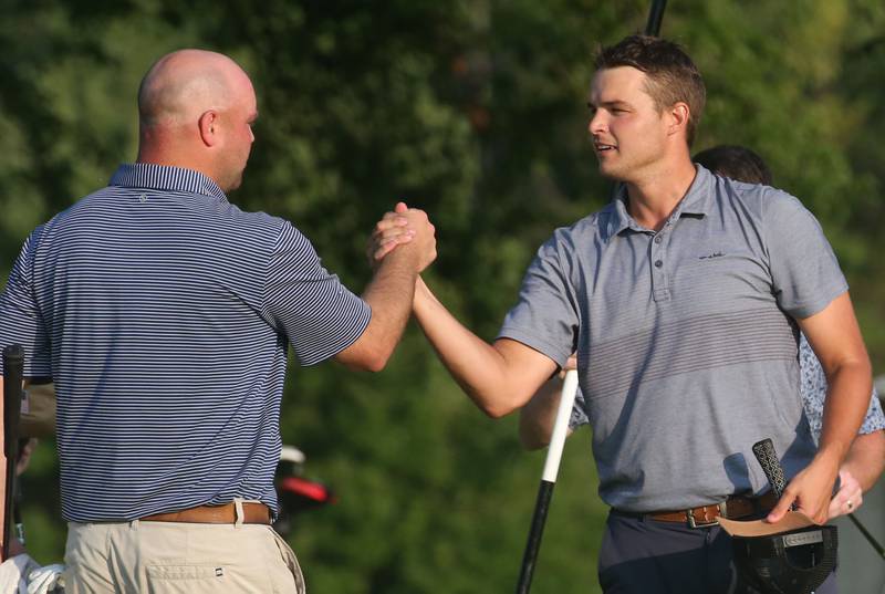 Baley Lehr (right) shakes hands with Josh Gass after winning the Illinois Valley Men's Golf Championship on Sunday, July 28. 2024, at Mendota Golf Club.