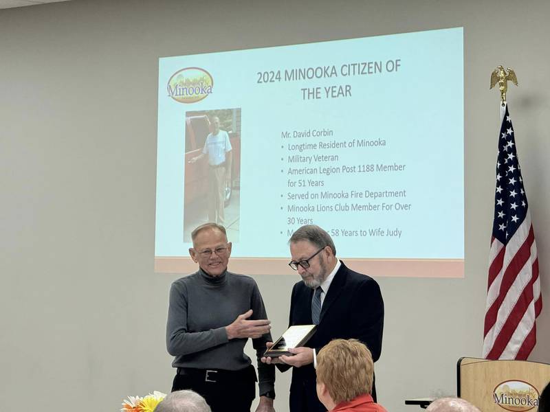 David Corbin accepts his award from Minooka Mayor Ric Offerman.