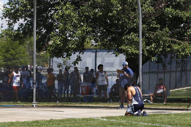 Cary-Grove’s Reece Ihenacho pauses to pray before throwing the discus during the IHSA Class 3A Boys State Track and Field Championship meet on Saturday, May 25, 2024, at Eastern Illinois University in Charleston.
