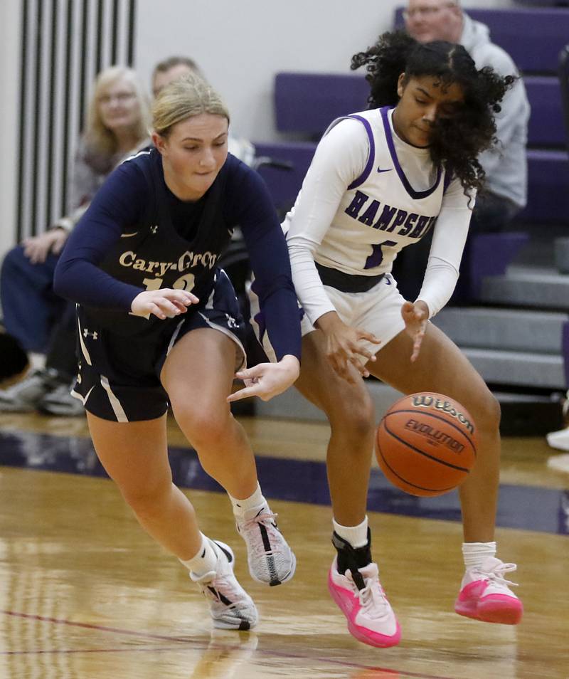 Cary-Grove's Malaina Kurth steals the ball from Hampshire's Ginger Younger during a Fox Valley Conference girls basketball game Friday, Jan. 26, 2024, at Hampshire High School.