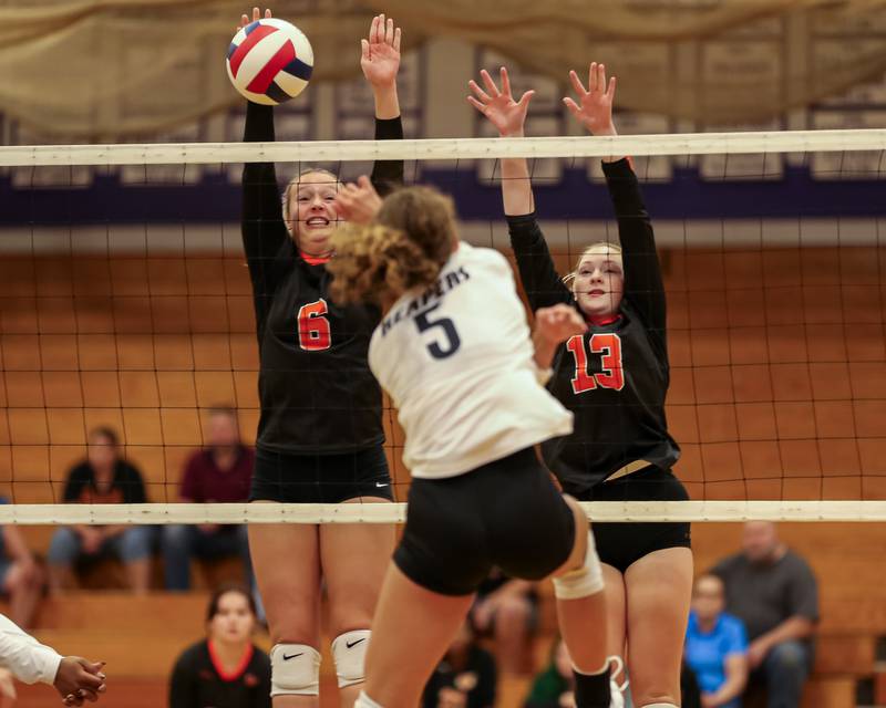 Sandwich's Londyn Scott (6) blocks a kill attempt during volleyball match between Sandwich at Plano.  August 21, 2023.