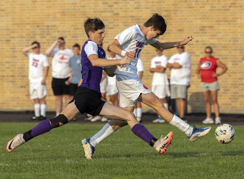 Dixon’s Ethan Bond and Oregon’s Aidan Hammer work for the ball Wednesday, Sept. 11, 2024, at EC Bowers field in Dixon.