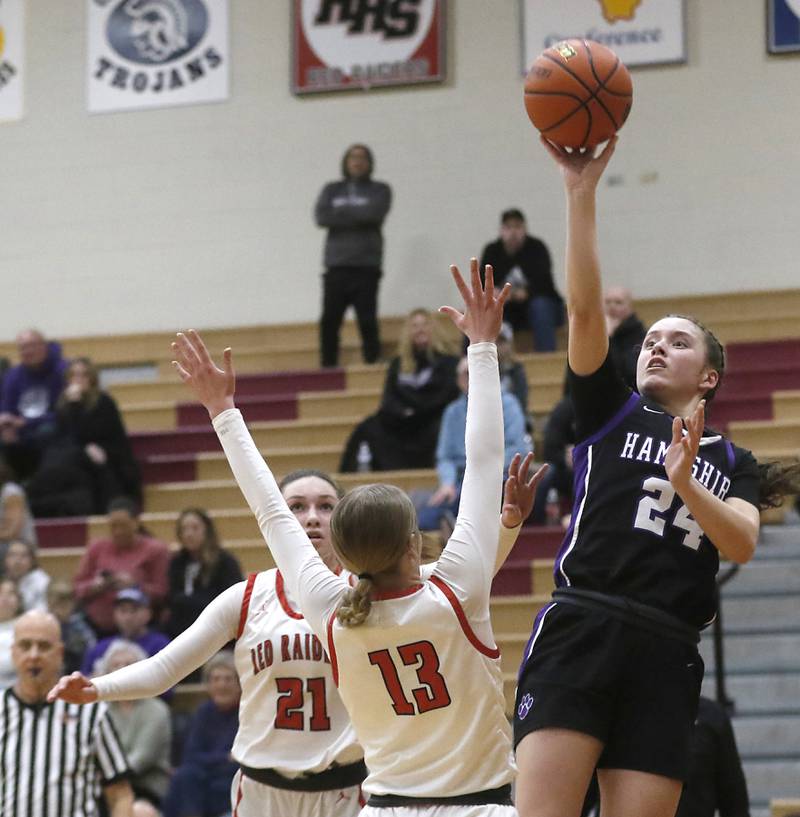 Hampshire's Lia Saunders shoots the ball over Huntley's Morgan McCaughn during a Fox Valley Conference girls basketball game Monday, Jan. 30, 2023, at Huntley High School.