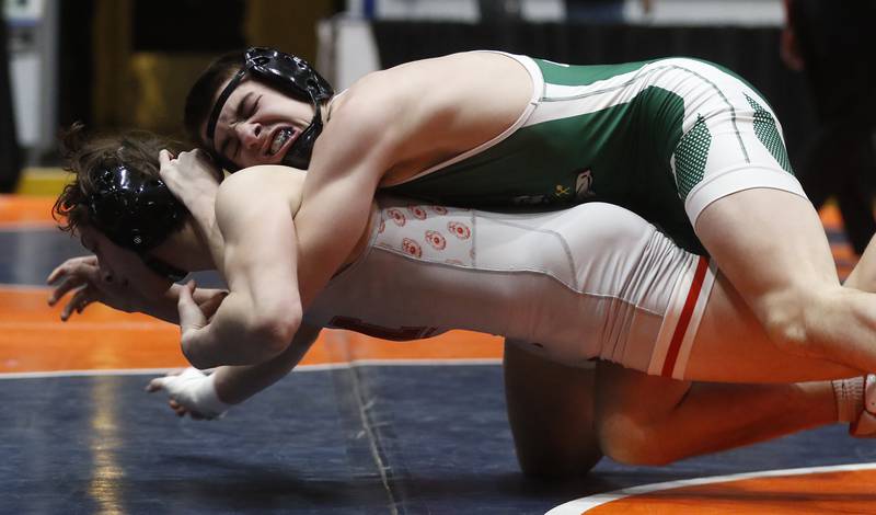 Coal City's Brock Finch tries to take down Marian Central's Josh Gawronski during the 144-pound match in the IHSA Class 1A Dual Team Sate Championship match Saturday, Feb. 24, 2024 at Grossinger Motors Arena in Bloomington.