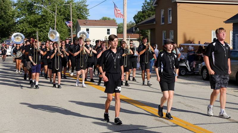 Drum Majors Luke McEvoy, Megan Fountain and Tommy Whitney, lead the Kaneland High School Marching Knights in the Maple Park Fun Fest Parade on Saturday, Sept. 2, 2023.