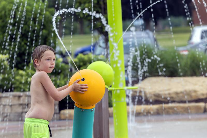 Wyatt Weaver, 7, fires a stream of water while staying cool at the Dixon splash pad Wednesday, July 5, 2023. Heat and humidity took the Sauk Valley by storm early this week.