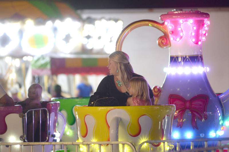 Chelsea Jones and her daughter, Ella, 5, of Oregon, ride the teacups at the Ogle County Fair on Friday, Aug. 4, 2023.