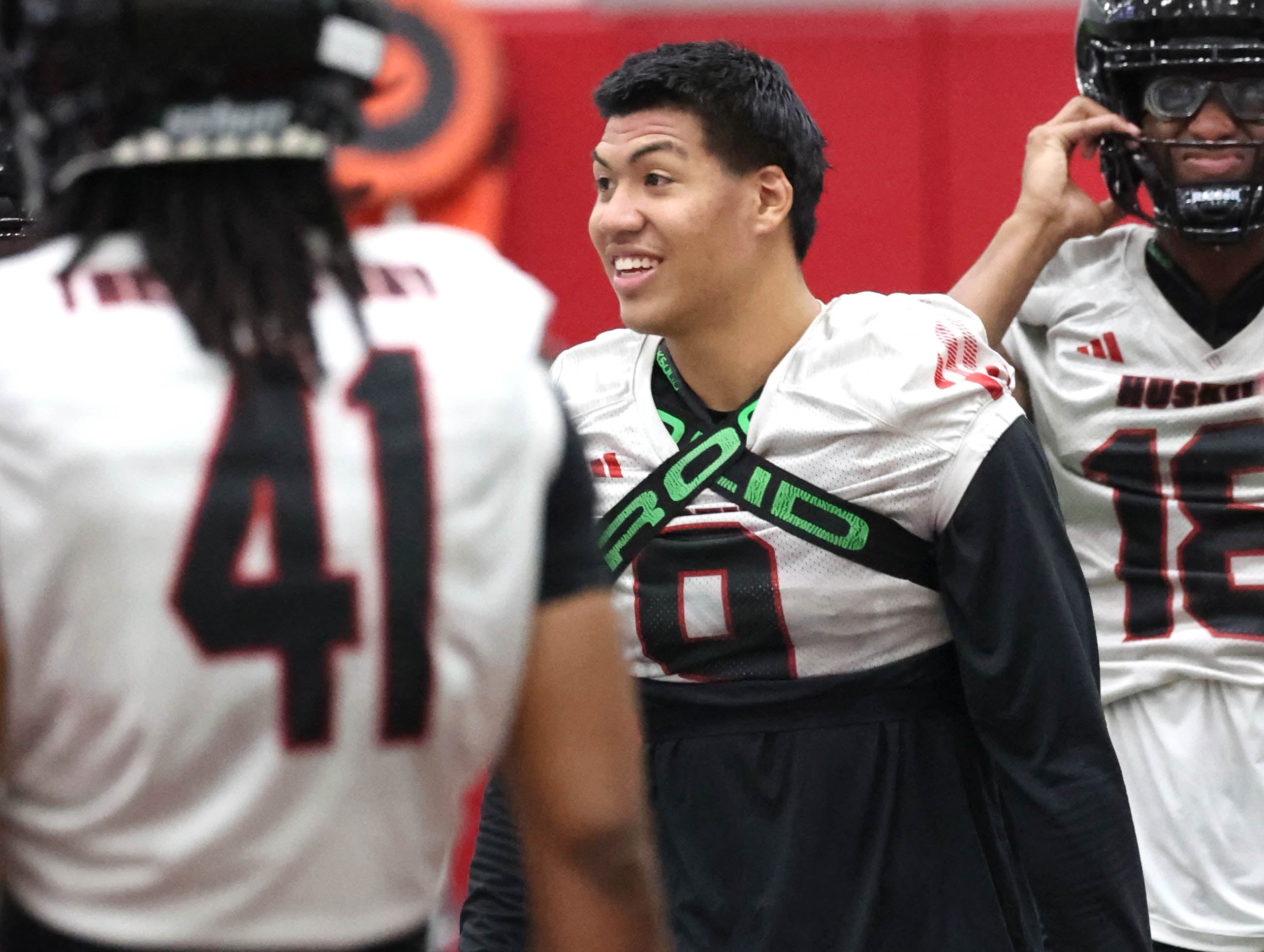 Northern Illinois University safety Nate Valcarcel talks to teammates during a break Wednesday, July 31, 2024, at practice in the Chessick Practice Center at NIU.