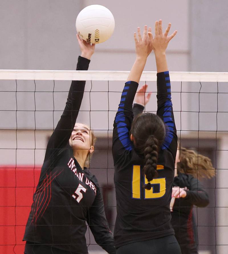 Indian Creek’s Alexa Anderson tries to tip the ball over Somonauk's Josie Rader during their regional first round match Tuesday, Oct. 25, 2022, at Aurora Christian High School in Aurora.