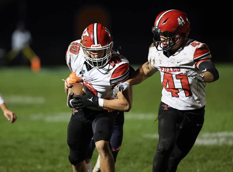 Yorkville’s Luke Zook (10) runs back an interception during the 2023 boys varsity football game against Oswego in Oswego.