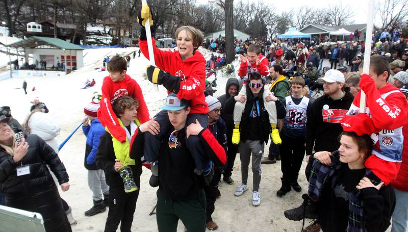 The Norge team enters the hill during opening ceremonies as part of the 119th Norge Annual Winter Ski Jump Tournament in Fox River Grove Sunday.