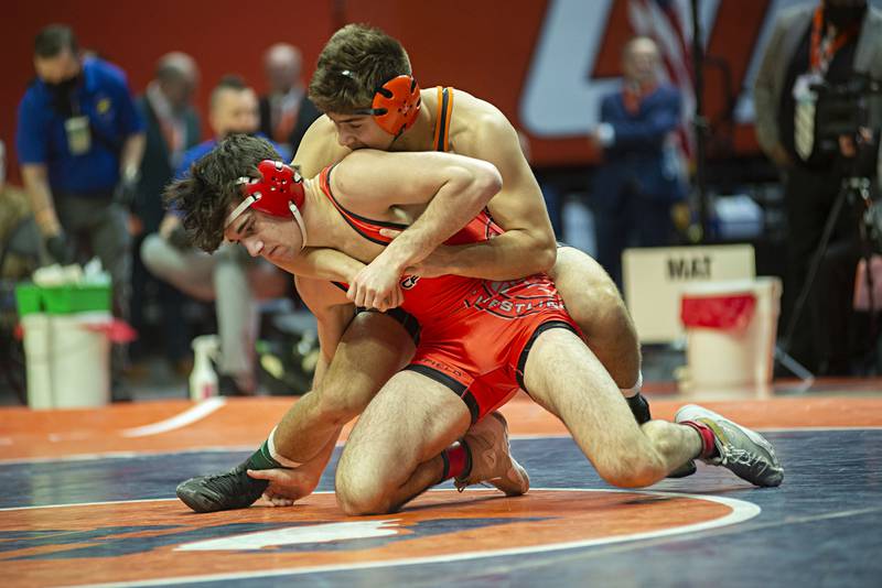 Crystal Lake Central's Dillon Carlson (back) and Deerfield's Benjamin Shvartsman face off in the 2A 160lb finals match at the IHSA state wrestling meet on Saturday, Feb. 19, 2022.