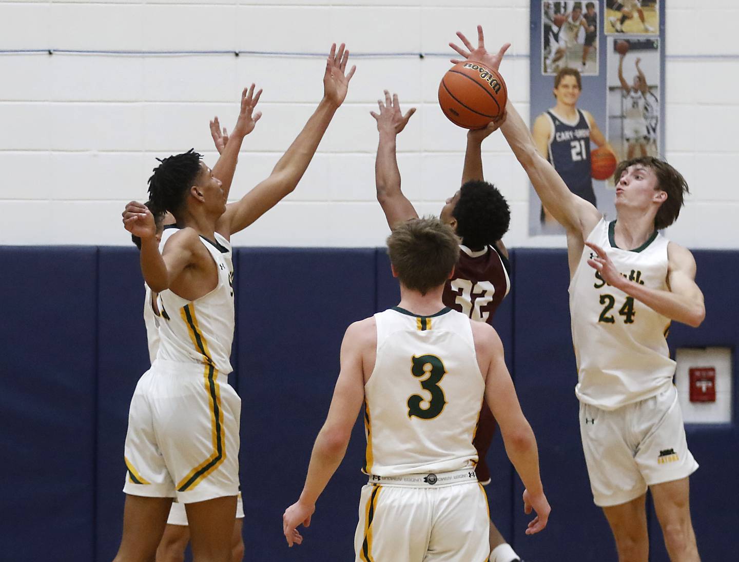 The Crystal Lake South defense calliopes on Wheaton Academy's Wandy Munoz as he trie to shoot the ball during the IHSA Class 3A Cary-Grove Boys Basketball Regional Championship game on Friday, Feb. 23, 2024 at Cary-Grove High School.