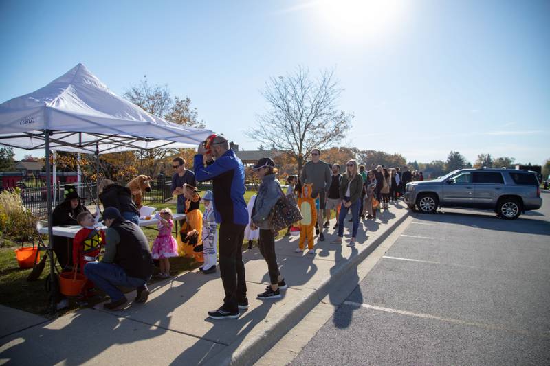 Boo Bash attendees lineup to be checked in at the Glen Ellyn Park District on Saturday Oct. 22, 2022.