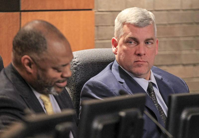 Mayor Bob O'Dekirk listens to council member Terry Morris speak to interim City Manager Steve Jones on Tuesday at City Hall in Joliet.