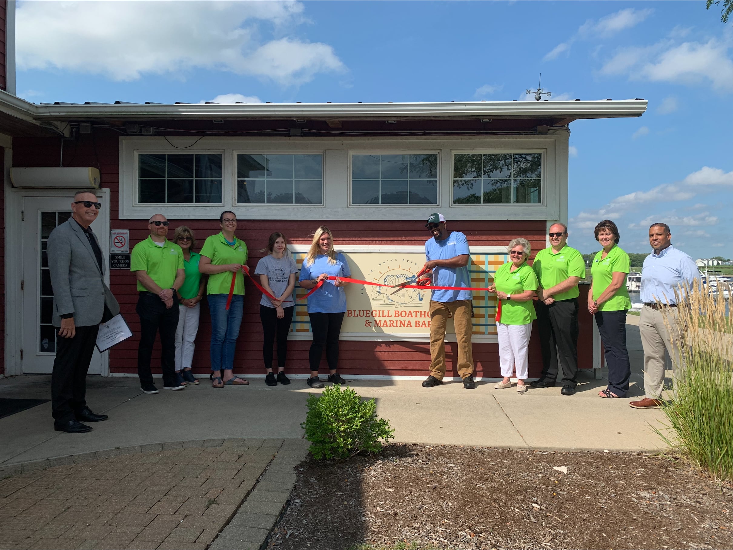 Bluegill Boathouse & Marina Bar cuts ceremonial ribbon to celebrate opening