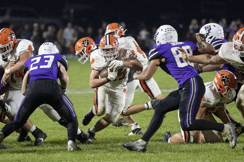 Byron’s Kole Aken hits the hole for a gain against Dixon Friday, Oct. 18, 2024, at A.C. Bowers Field in Dixon.