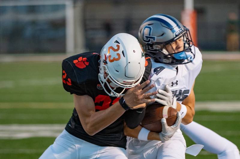 Plainfield East's Camden McCloskey pushes Oswego East's Lincoln Ijams out of bounds during a game on Thursday Sept. 12, 2024 at Plainfield East High School