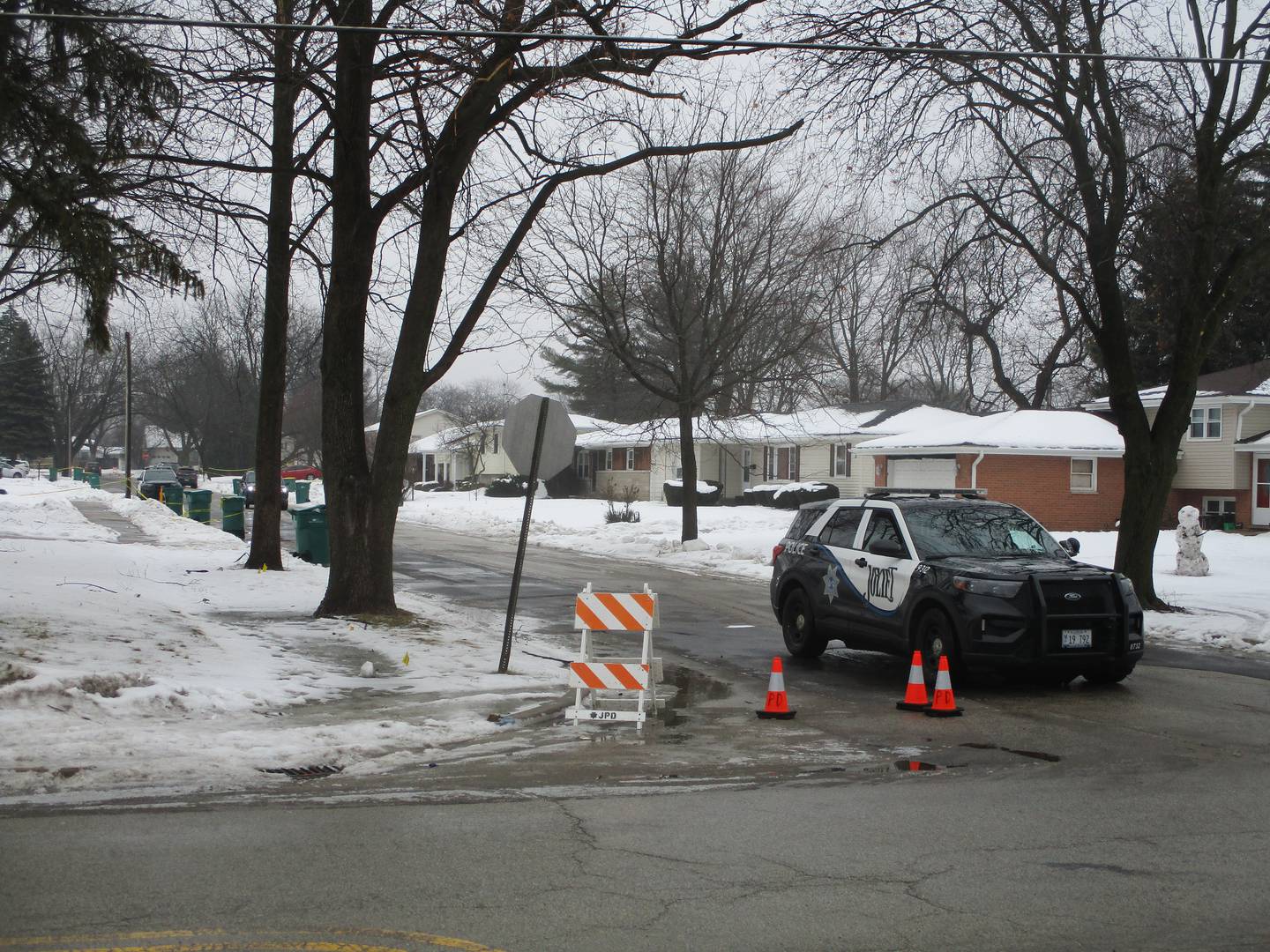 A Joliet police car and barriers block entry to the 2200 block of West Acres Road from Springfield Avenue on Tuesday, Jan. 23, 2024.