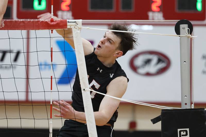 Plainfield North’s Cole Clarke follows through on a kill against Lincoln-Way East on Tuesday, April 2, 2024.