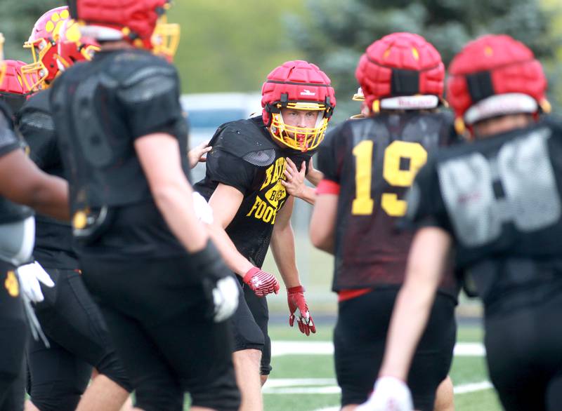 Batavia’s Jacob Jansey (center) runs drills with the defense during a practice on Wednesday, Aug. 28, 2024 at the school.