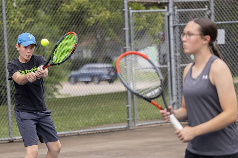 Joel Rhodes returns a shot Wednesday, July 27, 2023 while playing mixed doubles in the Emma Hubbs Tennis Classic in Dixon.