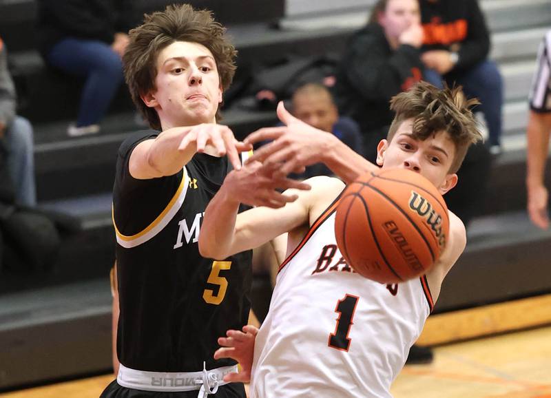 Metea Valley's Jake Nosek and DeKalb’s Jackson Kees go after a rebound during their game Friday, Jan. 19, 2024, at DeKalb High School.