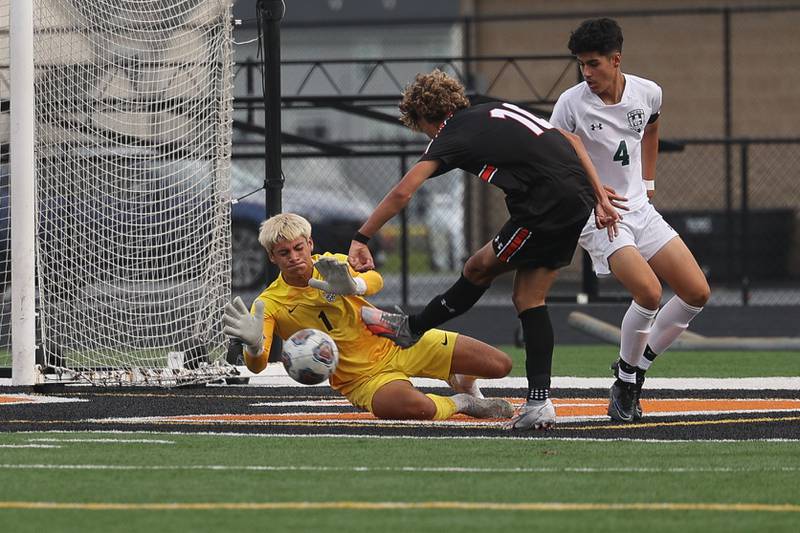 Plainfield Central’s Marshall Degraff blocks a shot by Plainfield East’s Yandel Reyes on Tuesday, Sept. 19, in Plainfield.