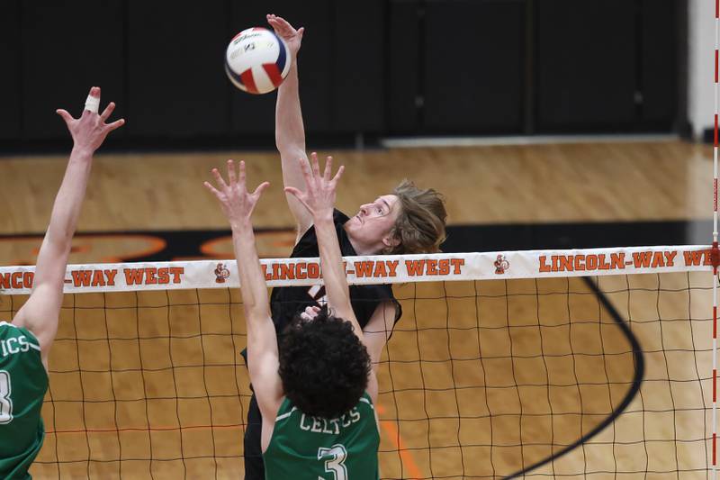 Lincoln-Way West’s Connor Jaral goes up for the kill against Providence on Wednesday, April 3, 2024 in New Lenox.